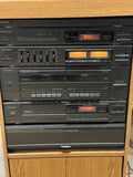 Stereo System, SAD, Phonograph, Synthesized AM/FM Tuner, Amplifier, Dual Deck Cassette Player, CD Player, Cabinet
