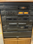 Stereo System, SAD, Phonograph, Synthesized AM/FM Tuner, Amplifier, Dual Deck Cassette Player, CD Player, Cabinet